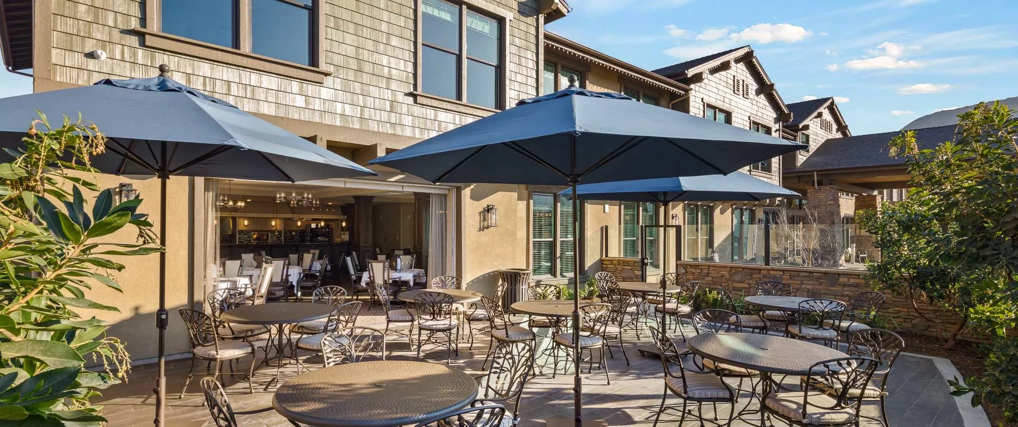Agoura Hills patio with dining tables and umbrellas