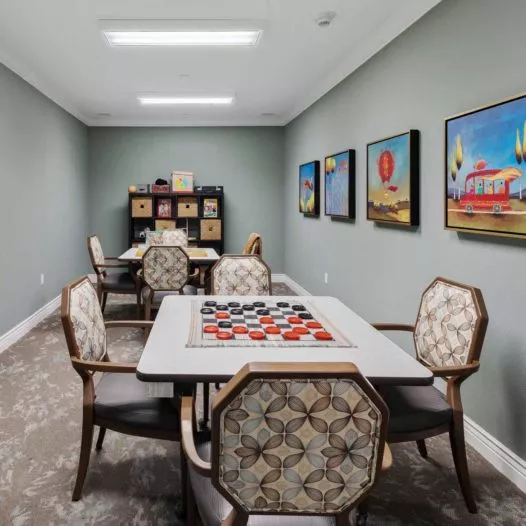 Burlingame activity room with game tables
