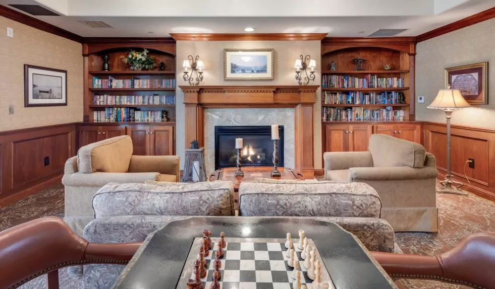 Escondido Hills activity room with chess table and fire place
