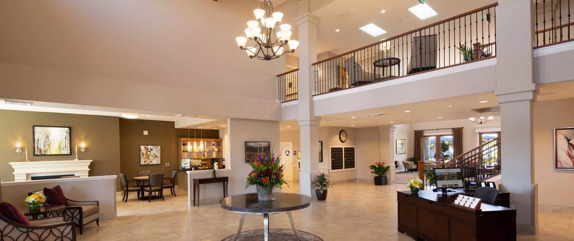 Fair Oaks entry hall with seating areas chandelier and a table with flowers