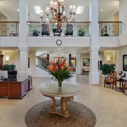 Fresno entry hall with chandelier and flower bouquet on table