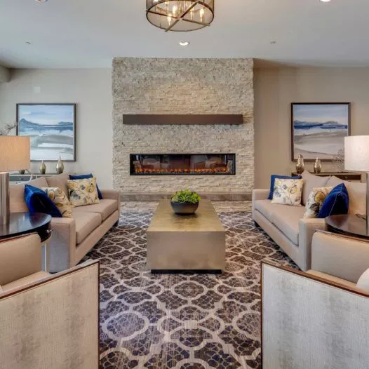 Huntington Beach lounge with fire place and sofas