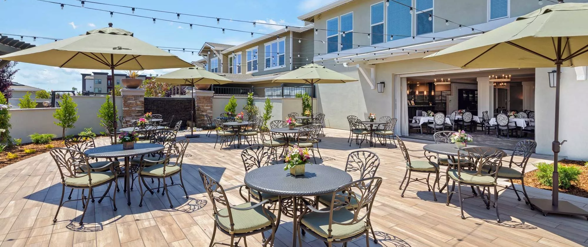 Lodi patio with string lights and dining tables