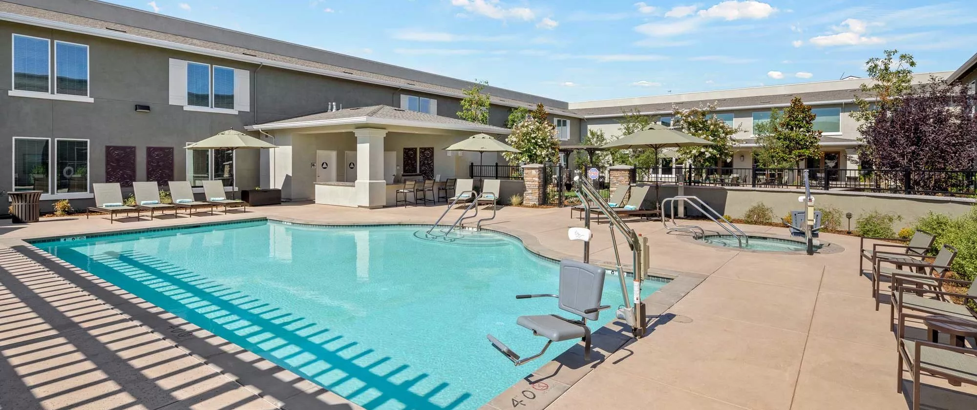 Lodi outdoor pool, hot tub and lounge chairs