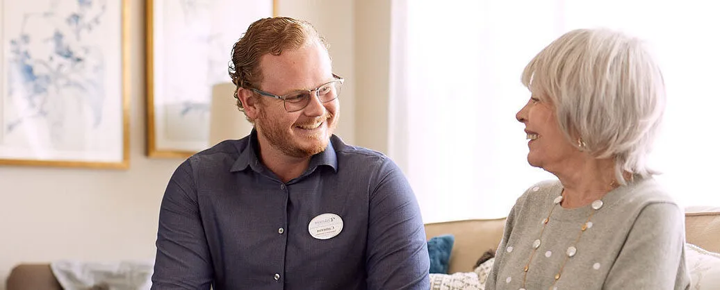Care giver is speaking to a senior lady