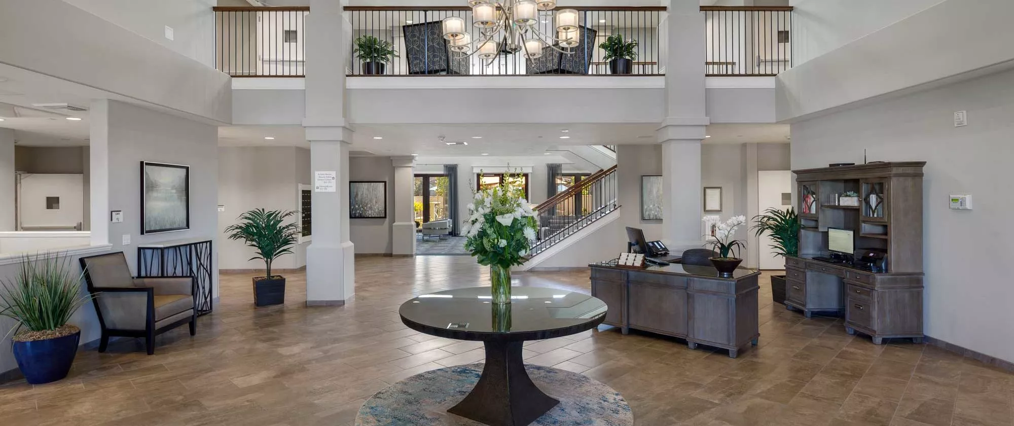 Riverpark elegant entry hall with chandelier
