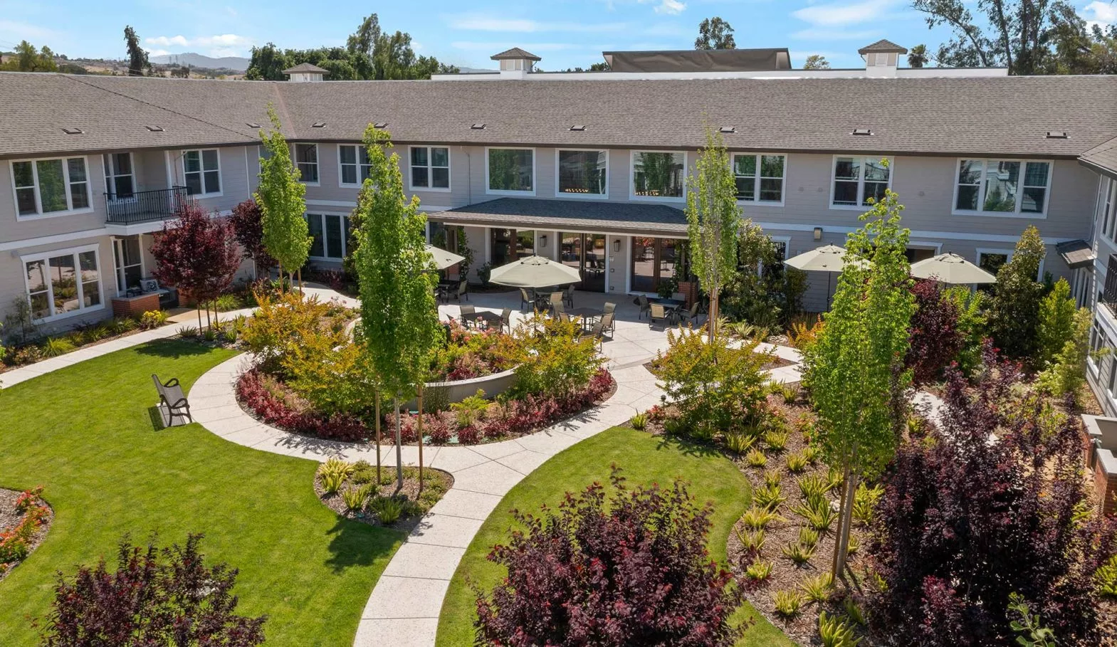 Silver Creek Aerial view of building with garden and patio