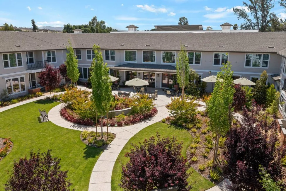 Silver Creek Aerial view of building with garden and patio