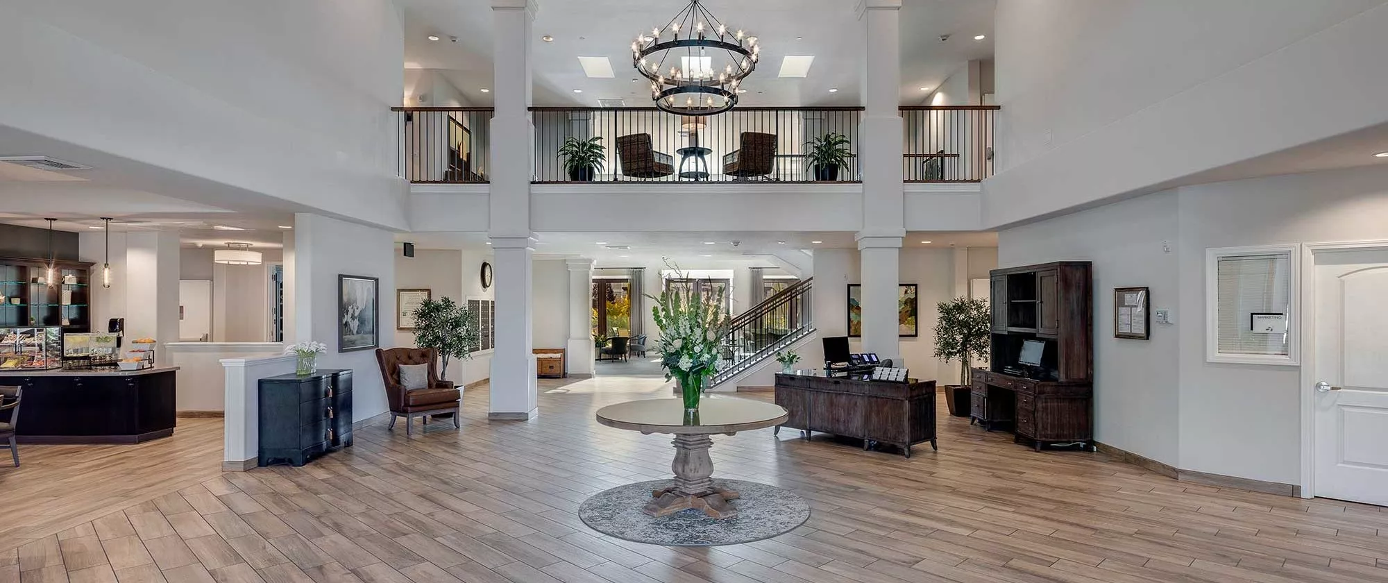 Silver Creek hall with reception desk and table with chandelier