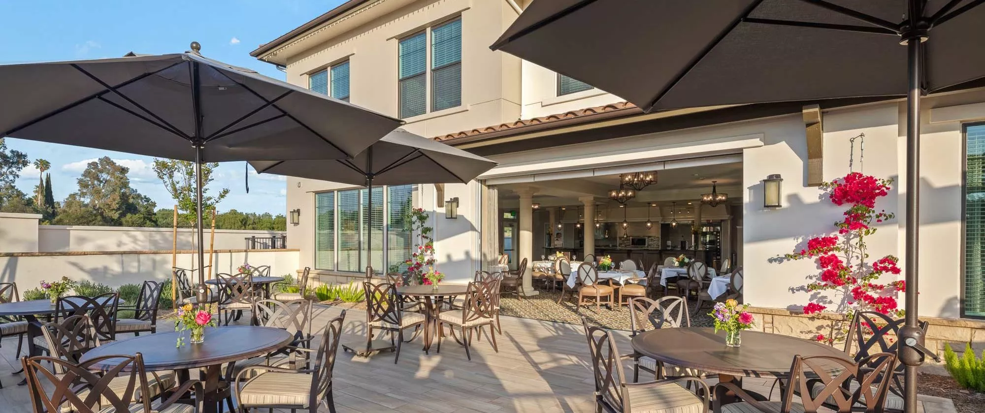 Simi Valley patio with dining tables and umbrellas
