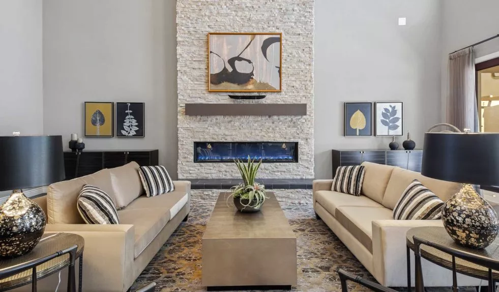 Torrance lounge with fire place and sofas