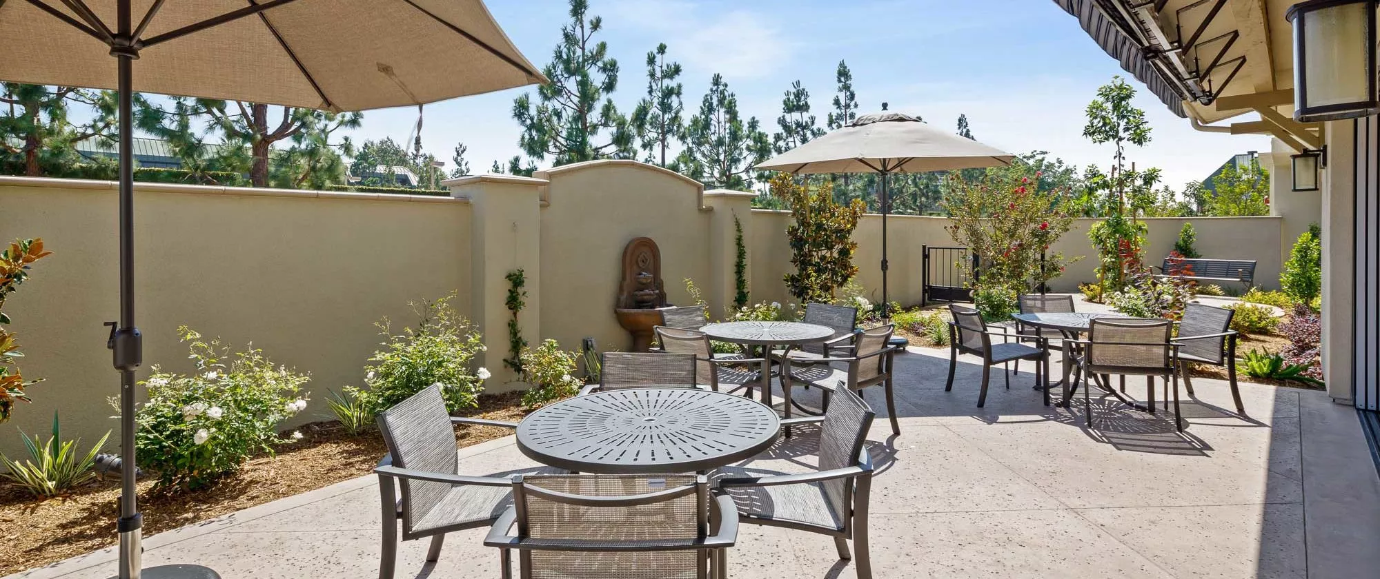 Torrance patio with umbrellas and dining tables