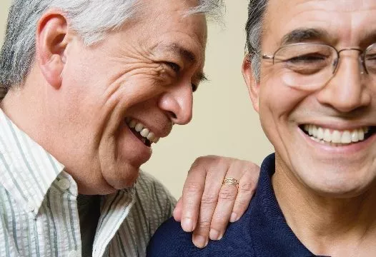 Two senior men laughing together