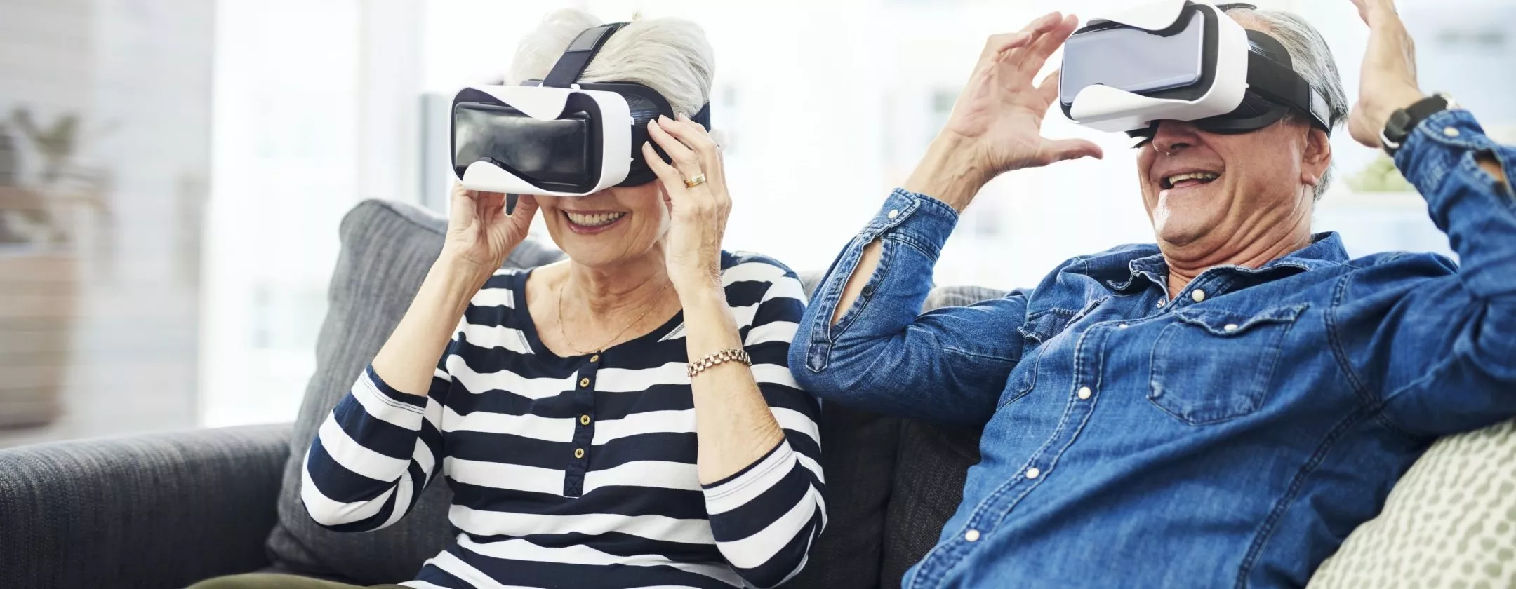 Senior couple using VR headset