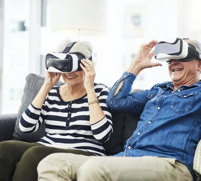Senior couple using VR headset