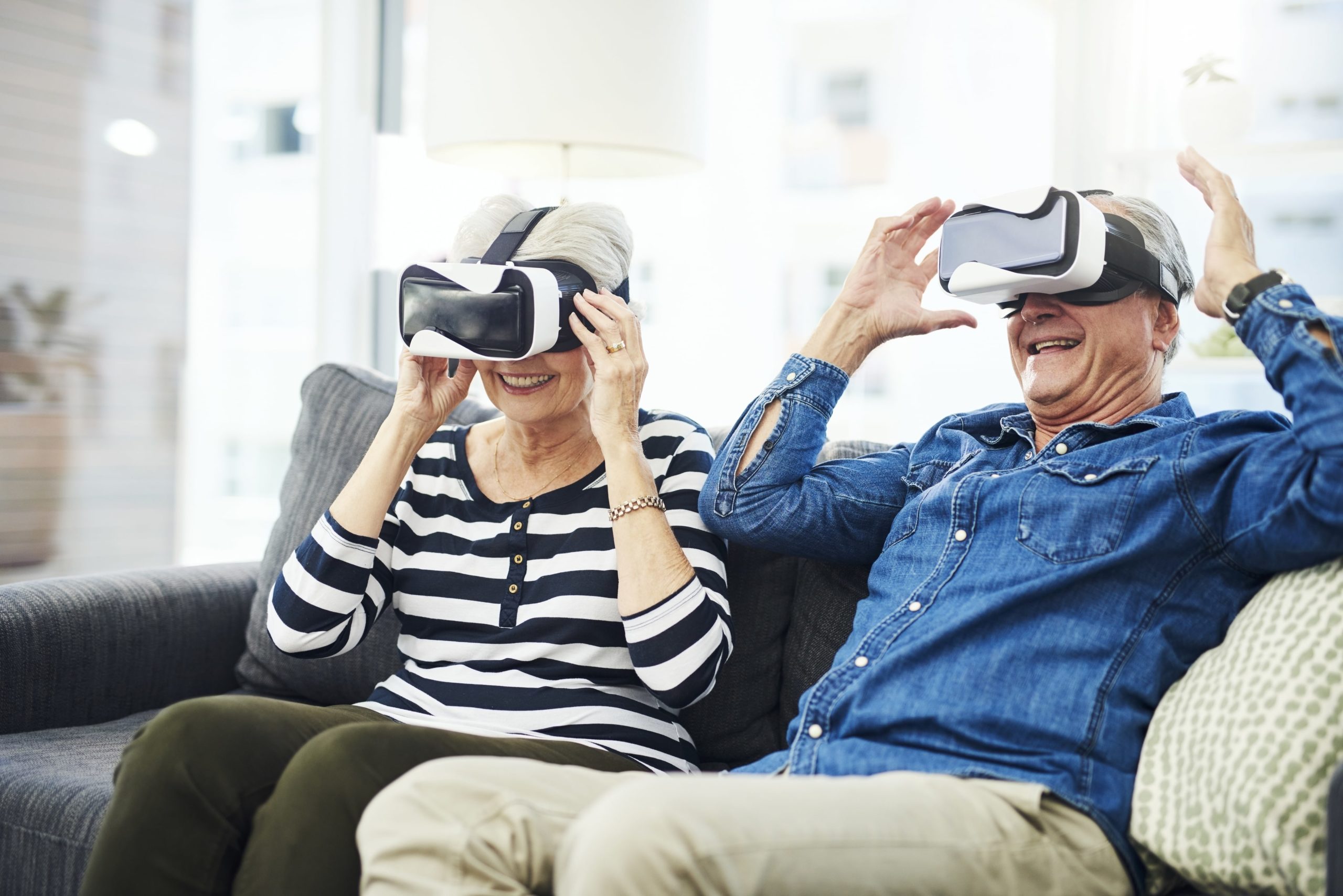 Senior couple using VR headset