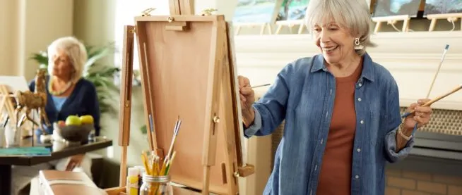 Senior woman painting