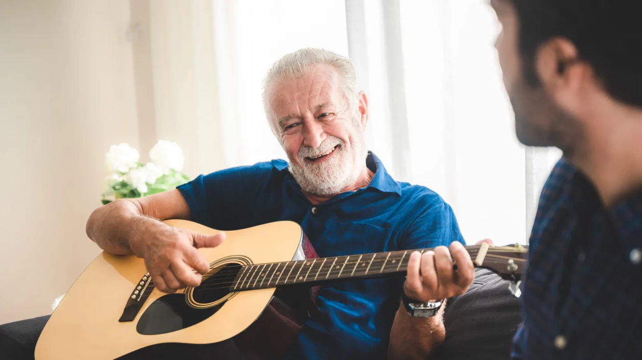 hobbies for seniors image of man playing guitar