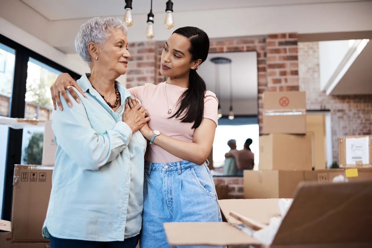 Senior woman moving into an assisted living facility with help from her daughter