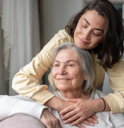 Daughter and mother at a memory care facility